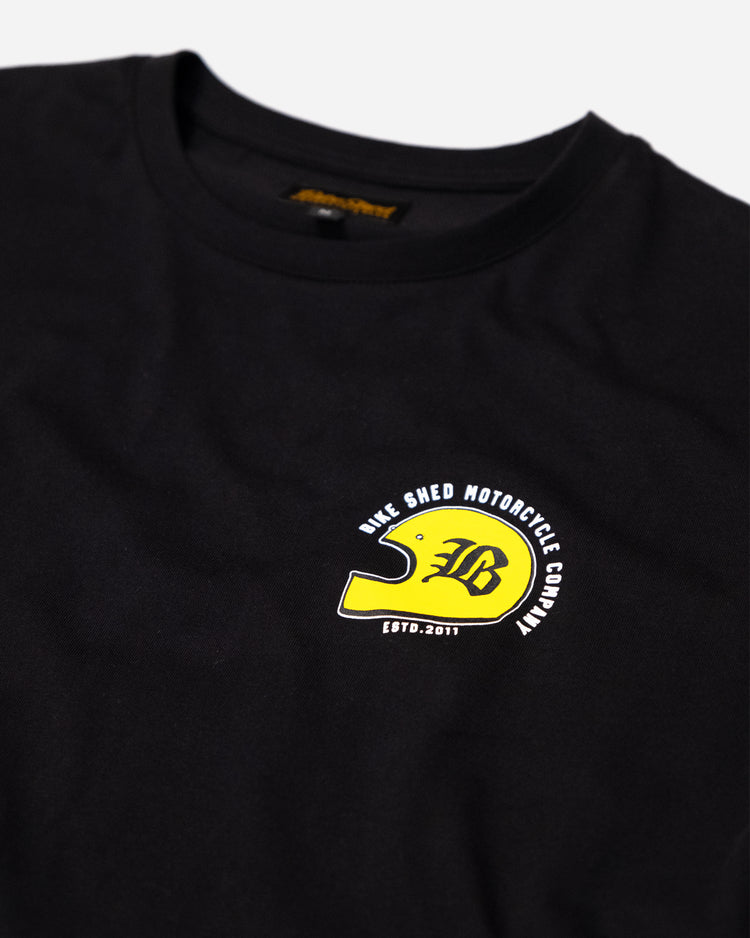 Black T-shirt with a graphic design of a  motorcycle helmet front detail
