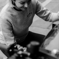 Kat wearing our Bike Shed Motorcycle Logo Sweatshirt - Grey Marl