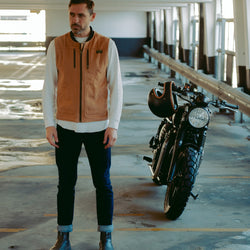 Sam wearing our BSMC Utility Vest - Tan