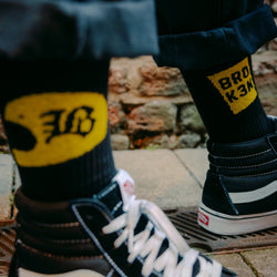"BROK3N" Socks Yellow  and black on feet