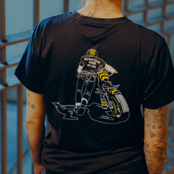 Black T-shirt with a graphic design of a person on a motorcycle back