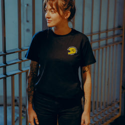 Black T-shirt with a graphic design of a  motorcycle helmet front