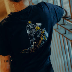 Black T-shirt with a graphic design of a person on a motorcycle back