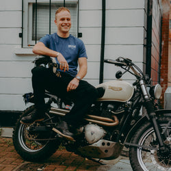 A navy-colored T-shirt with 'BIKE SHED MOTORCYCLE CO.' printed on the front.