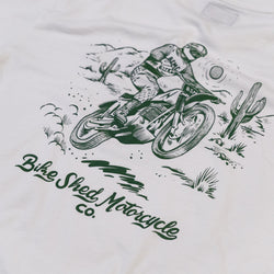 White t-shirt with green motorcycle graphic and 'Bike Shed Motorcycle Co.' text logo on a white background