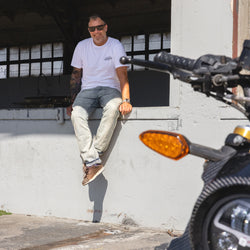 Dan smiling at the camera while wearing our BSMC Motorcycle Garage T Shirt - White & Black