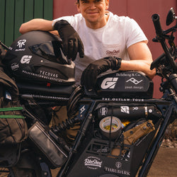Harry smiling wearing our BSMC Logo Chain embroidered T Shirt  - Off White