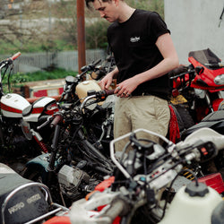 Joe inspecting bike in our BSMC Logo Chain Embroidered T Shirt - Black