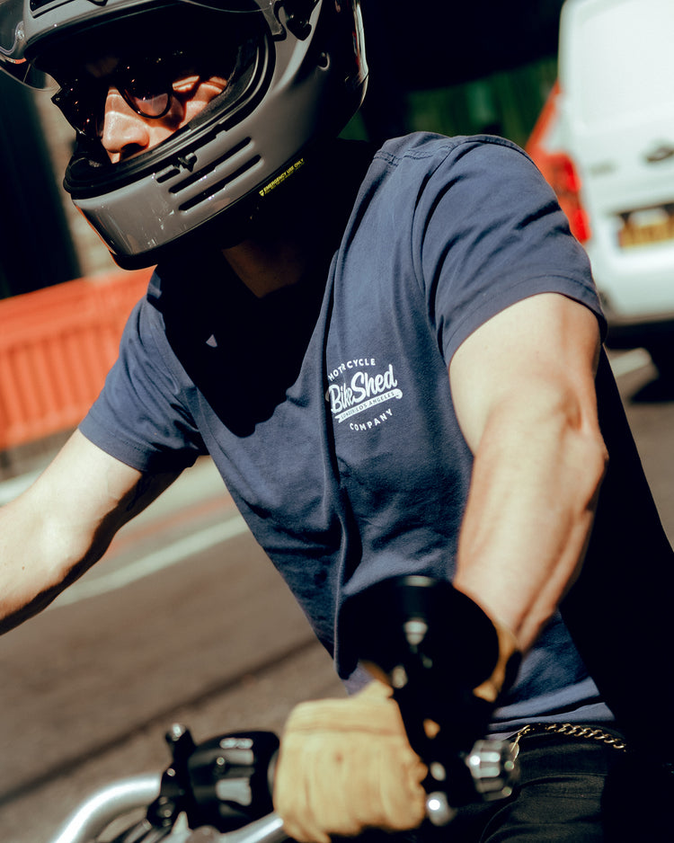 Steve wearing our BSMC Company Logo T-Shirt - Navy while riding through traffic