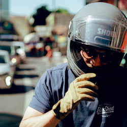 Steve adjusting his helmet while wearing our BSMC Company Logo T-Shirt - Navy