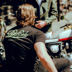 Harry chatting while wearing our BSMC Motorcycle Garage T Shirt - Black & Gold
