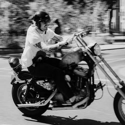 James riding his Harley wearing our Bike Shed Moto Co. Company T-Shirt - Off White