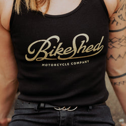 Model posing wearing our Women's Motorcycle Garage Ribbed Tank Top - Black