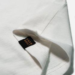 Hem tag close up of our Bike Shed Moto Co. Company T-Shirt - Off White