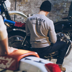 Harry in the workshop wearing our Bike Shed Motorcycle Logo Sweatshirt - Grey Marl