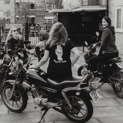 Anna chatting while wearing our Bike Shed Motorcycle Company - Black & White