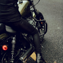 Clare on her Harley wearing our Motorcycle Resistant Women's Skinny Jean - Black