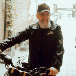 Brian wearing our Motorcycle embroidered logo baseball hat - Black & Gold