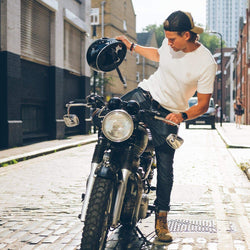 Harry getting off his bike while wearing our BSMC Waffle T Shirt - Cream