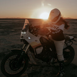Caro sitting on her Tenere wearing our Motorcycle Wing Race Jersey - Gold