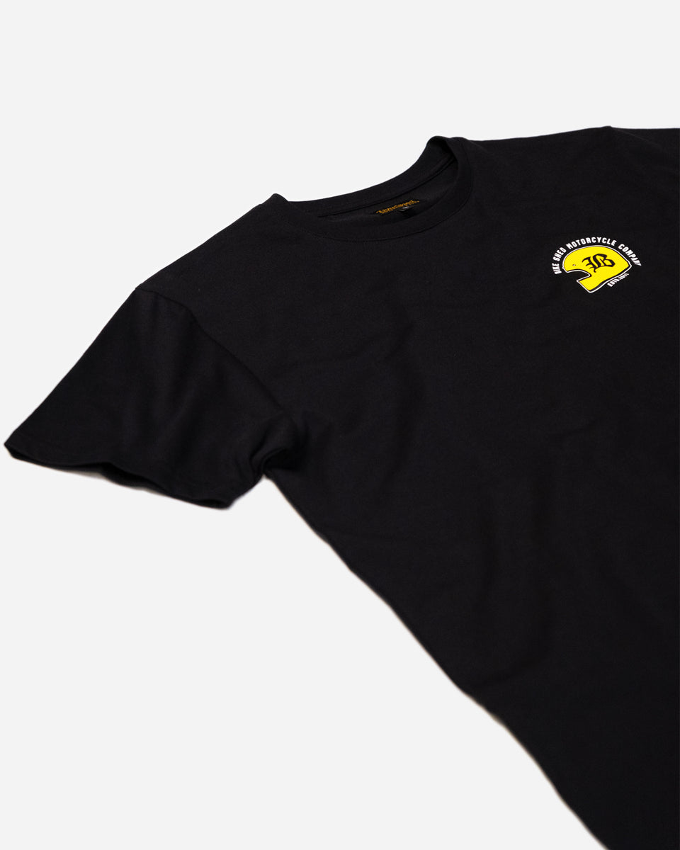 Black T-shirt with a graphic design of a  motorcycle helmet front detail