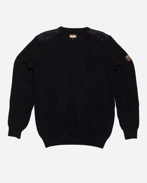 A black knit crew neck sweater with the Bike Shed Moto Co. brand label visible on the lower left side.