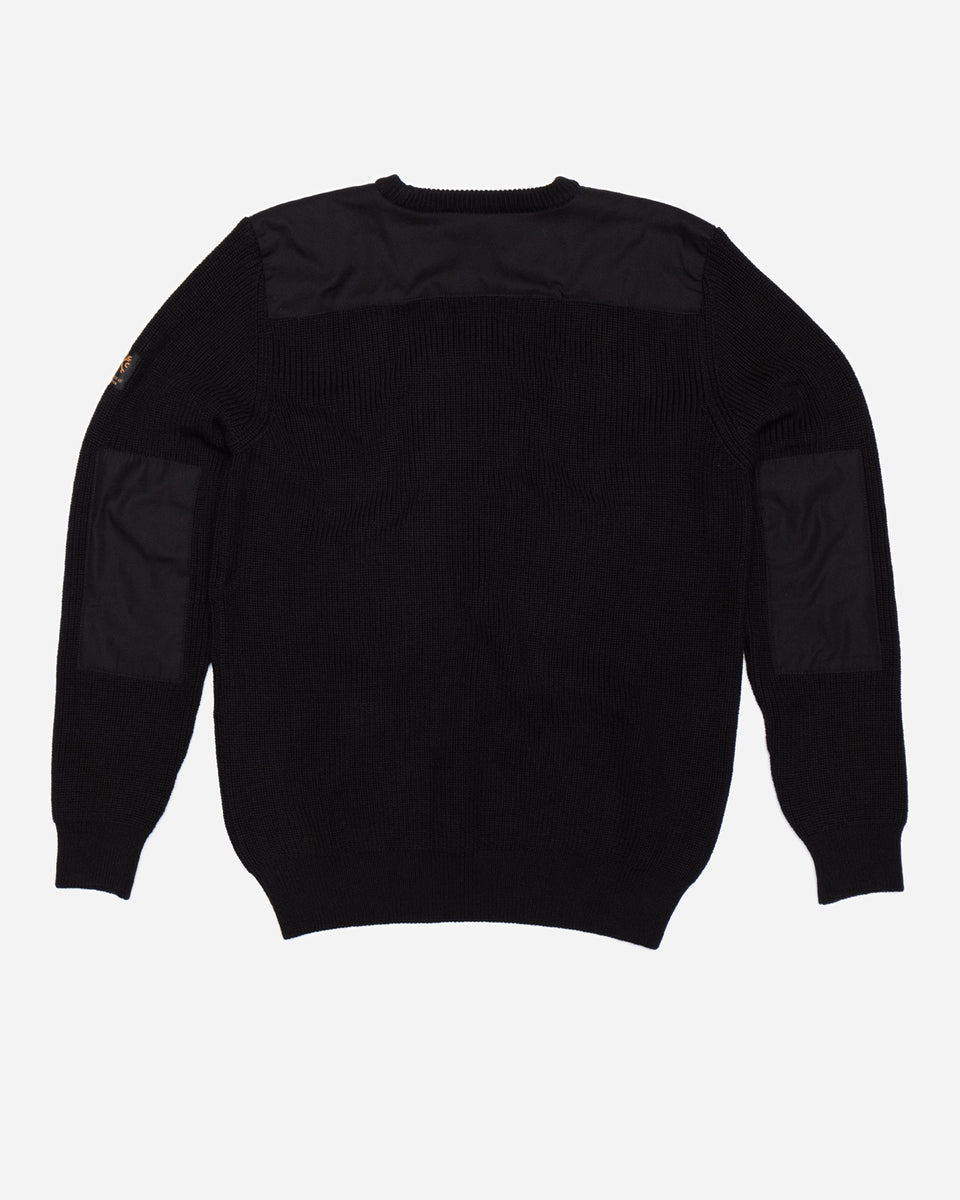 A black knit crew neck sweater with the Bike Shed Moto Co. brand label visible on the lower left side.