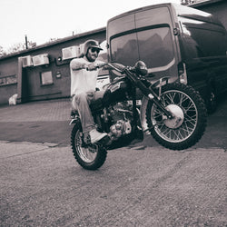 Hawkeye Moto pulling a wheelie wearing our BSMC Dirt Shot T-Shirt - White