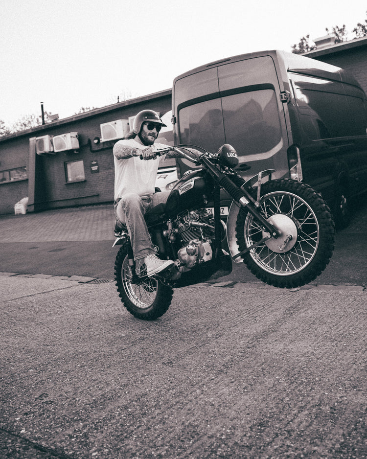 Hawkeye Moto pulling a wheelie wearing our BSMC Dirt Shot T-Shirt - White