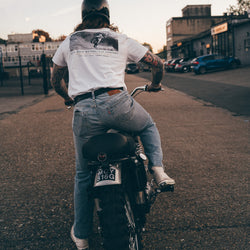 Hawkeye Moto on his Triumph wearing our BSMC Dirt Shot T-Shirt - White