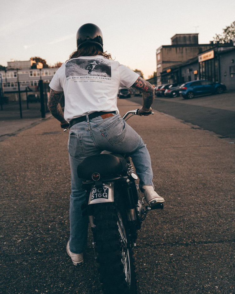 Hawkeye Moto on his Triumph wearing our BSMC Dirt Shot T-Shirt - White