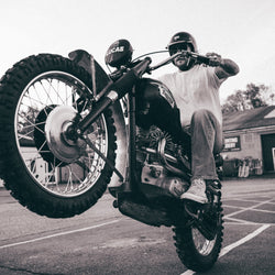 Hawkeye Moto pulling a wheelie wearing our BSMC Dirt Shot T-Shirt - White