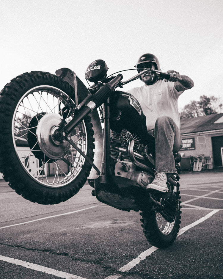 Hawkeye Moto pulling a wheelie wearing our BSMC Dirt Shot T-Shirt - White