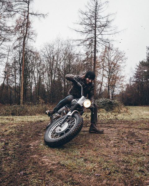 A black knit crew neck sweater with the Bike Shed Moto Co. brand label visible on the lower left side.
