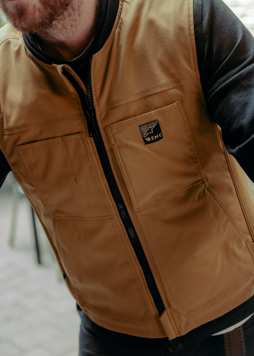 A tan Alpinestars Tech-Air 3 canvas airbag vest with a front zipper and logo on the chest.