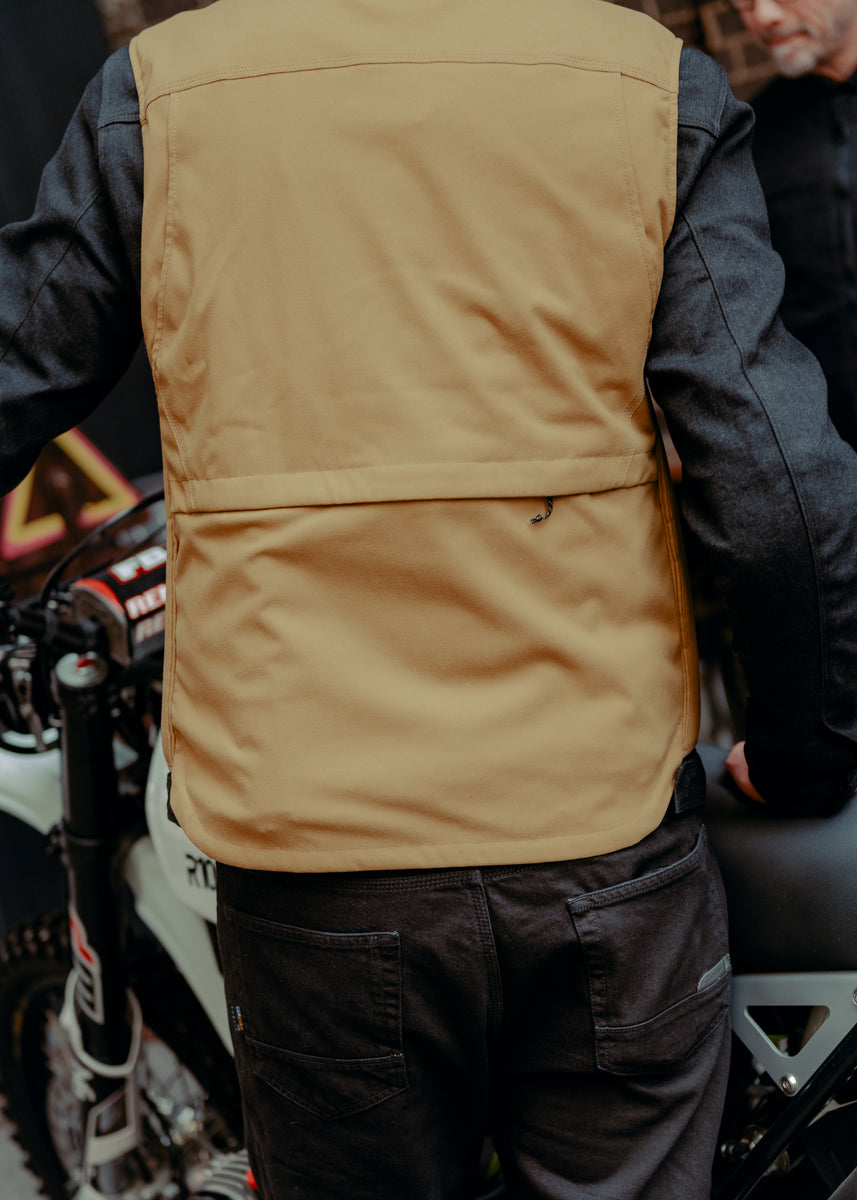A tan Alpinestars Tech-Air 3 canvas airbag vest with a front zipper and logo on the chest.
