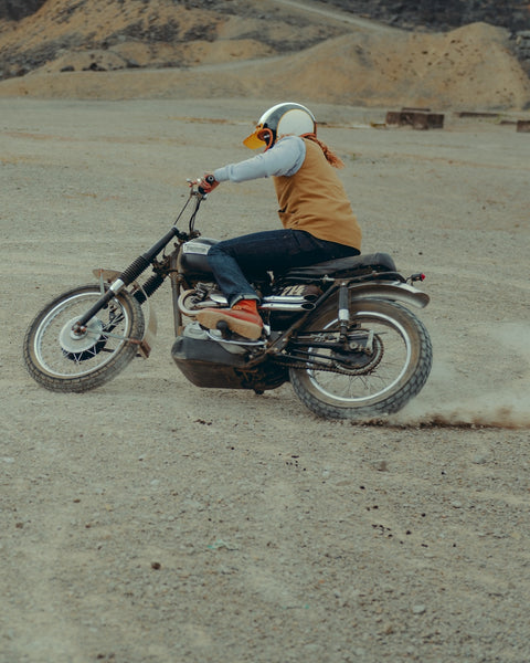 BSMC Utility Vest - Tan worn by model sliding a motorcycle