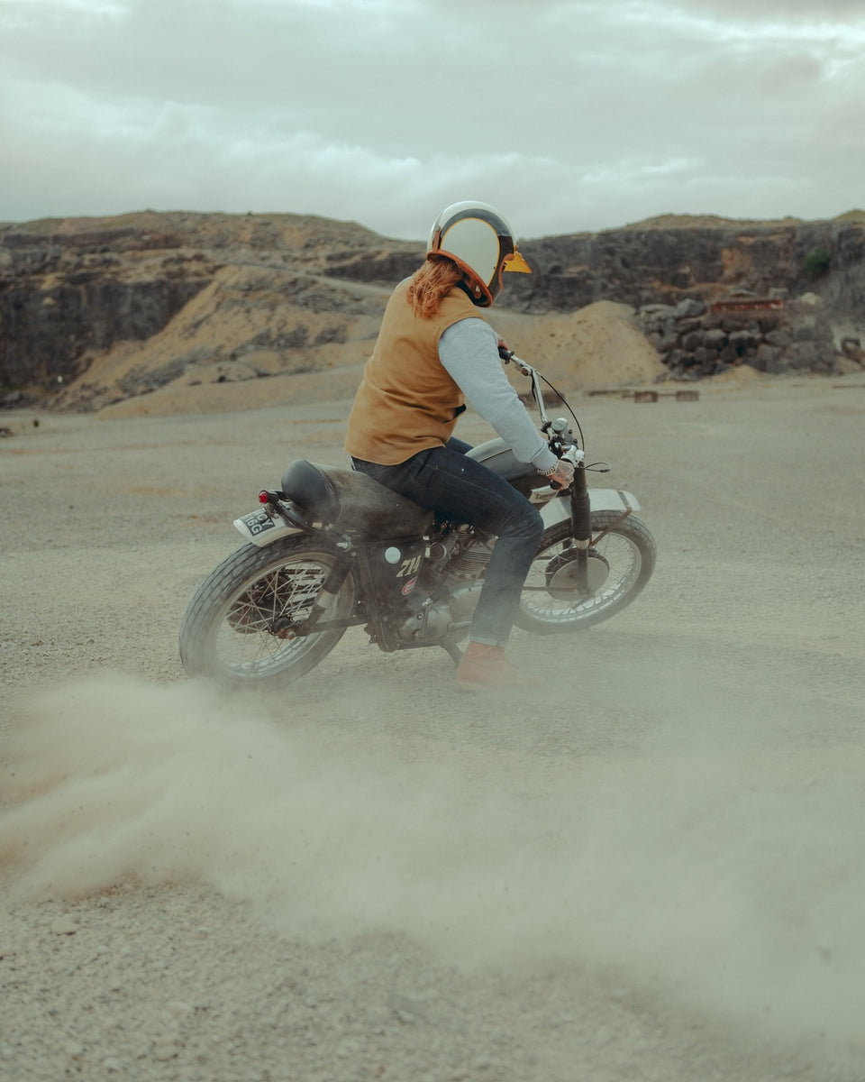 BSMC Utility Vest - Tan worn by a model riding a bike