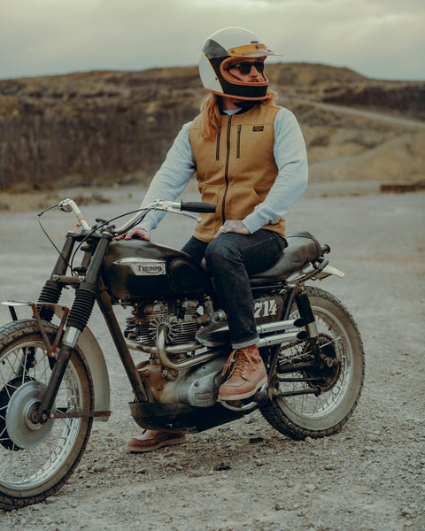 BSMC Utility Vest - Tan worn by model sitting on a motorcycle
