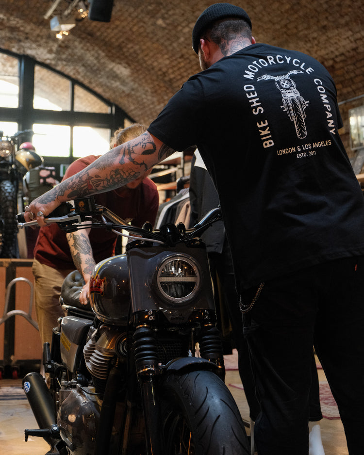 Liam wearing our BSMC Tracker Bars T-Shirt - Black