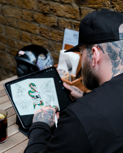 A black snapback baseball hat with 'Bike Shed Moto Co.' logo embroidered on the front.
