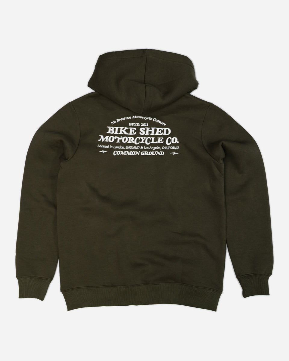 Green hoodie with 'Bike Shed Motorcycle Co.' embroidered on the back.