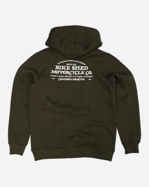 Green hoodie with 'Bike Shed Motorcycle Co.' embroidered on the back.