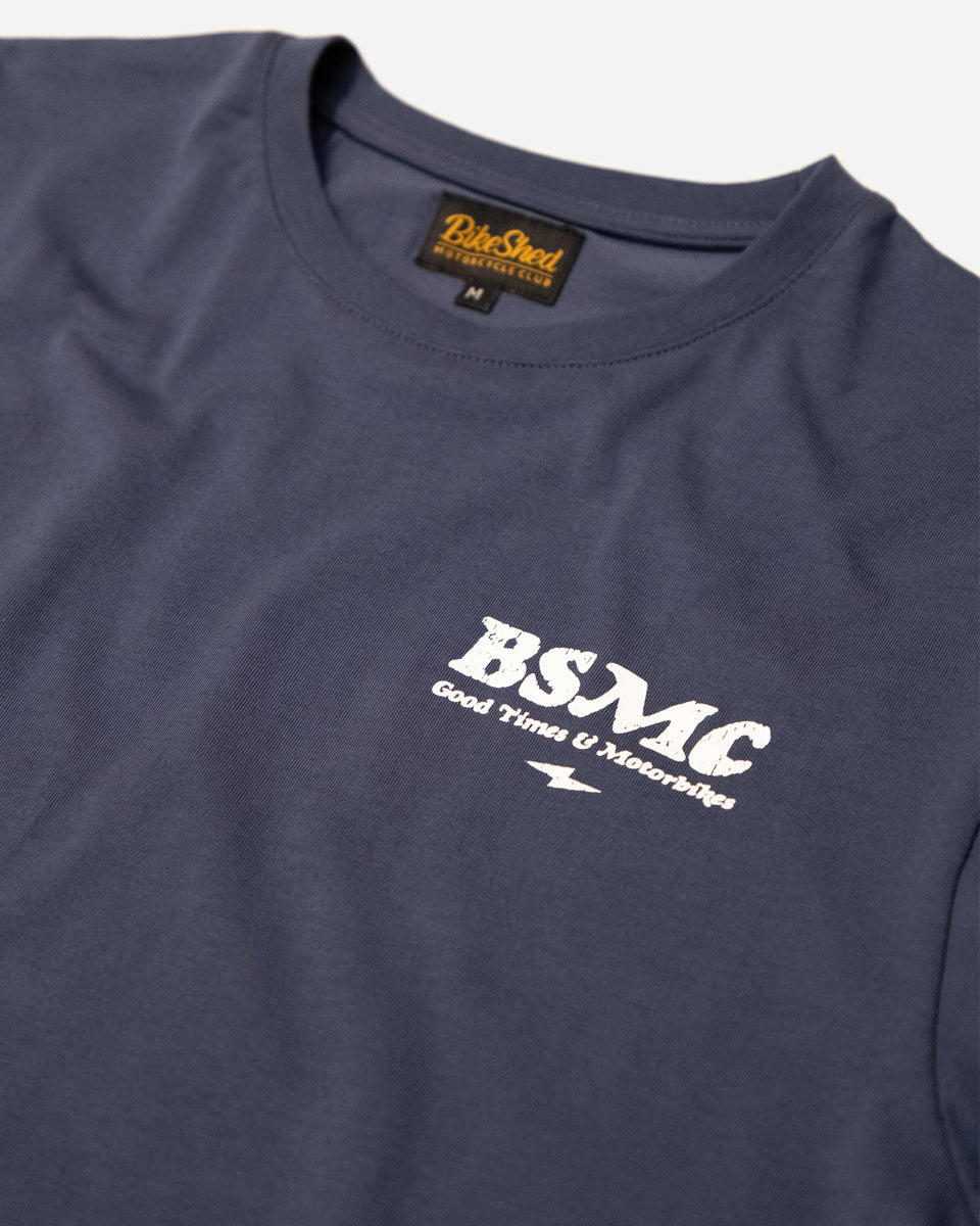 A navy-colored T-shirt with 'BIKE SHED MOTORCYCLE CO.' printed on the front.