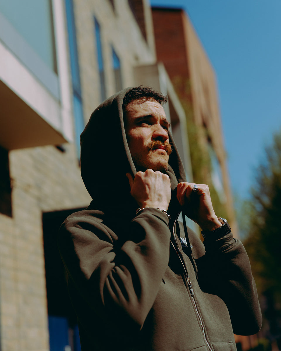 Green hoodie with 'Bike Shed Motorcycle Co.' embroidered on the front