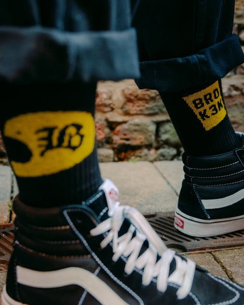 "BROK3N" Socks Yellow  and black on feet