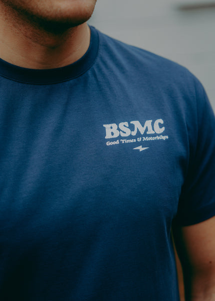 A navy-colored T-shirt with 'BIKE SHED MOTORCYCLE CO.' printed on the front.