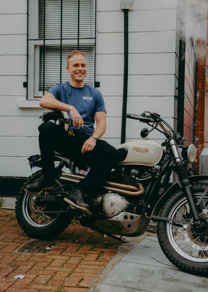 A navy-colored T-shirt with 'BIKE SHED MOTORCYCLE CO.' printed on the front.