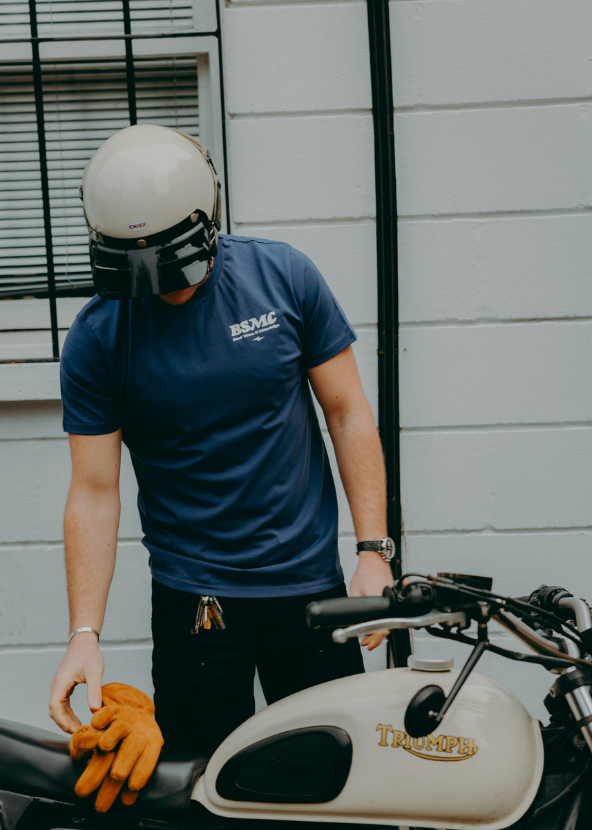 A navy-colored T-shirt with 'BIKE SHED MOTORCYCLE CO.' printed on the front
