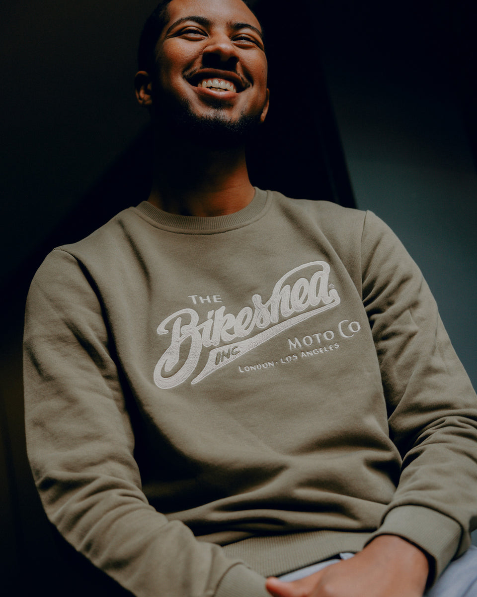 Kyle wearing Inc Applique Sweatshirt Khaki